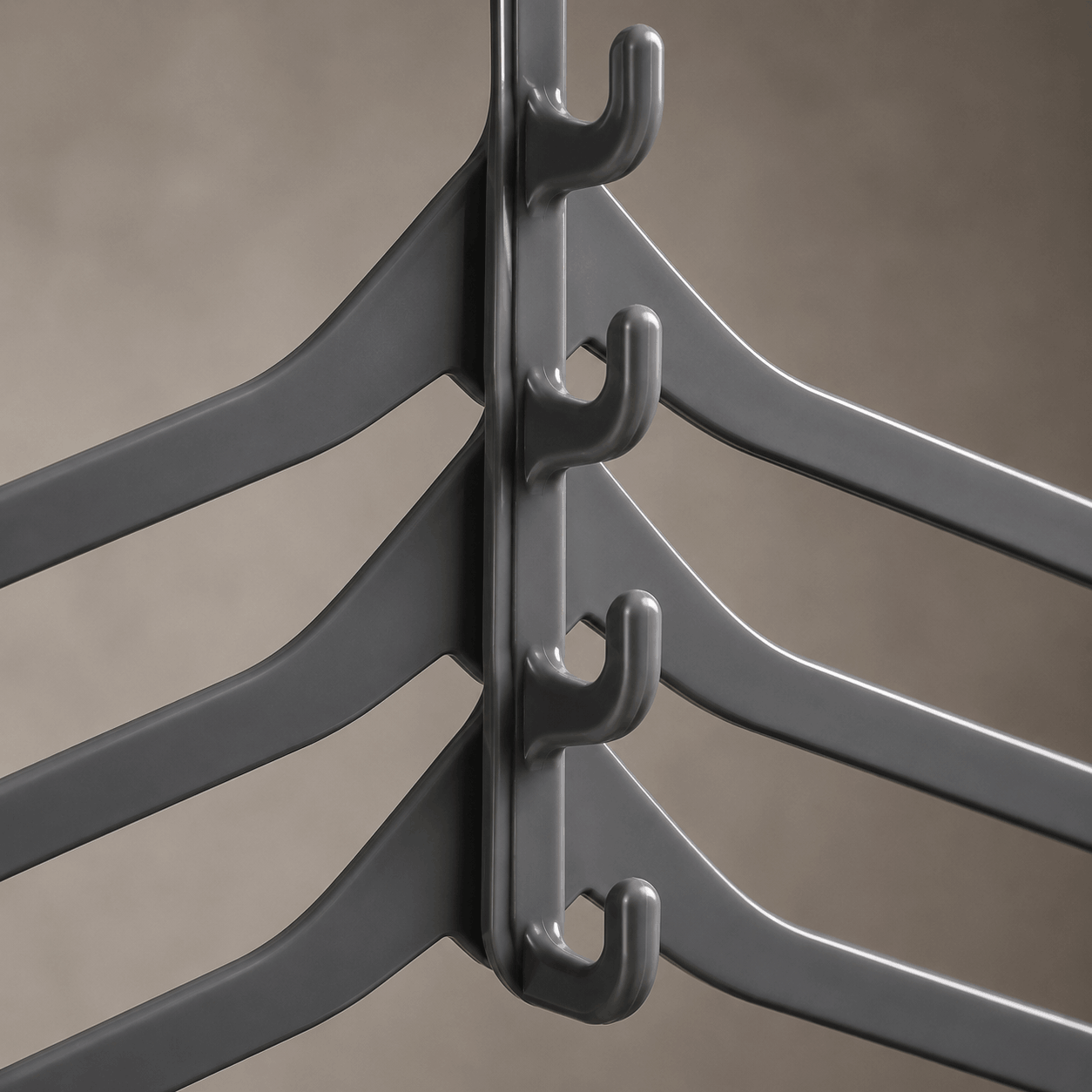 Close-up of the cascading hanger hook mechanism and space-saving hanger design