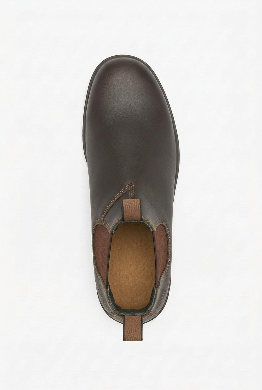 Top-down view of a single dark brown leather Chelsea boot with elastic side panels and pull tabs.
