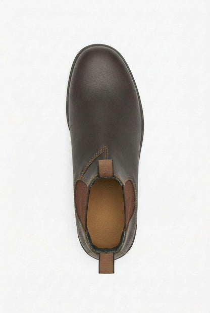 Top-down view of a single dark brown leather Chelsea boot with elastic side panels and pull tabs.