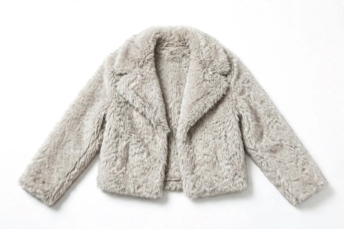 Flat lay front view of a light grey cropped faux fur jacket with notched lapels.