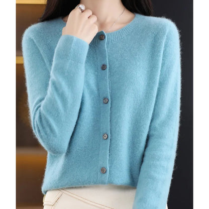 Front view of a woman wearing a light blue fine knit button-front cardigan, with all buttons fastened.