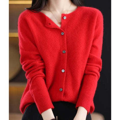 A model wears a red button-up cardigan.