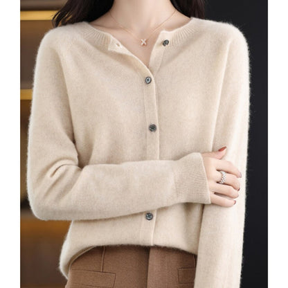 A model wears an off-white button-up cardigan.