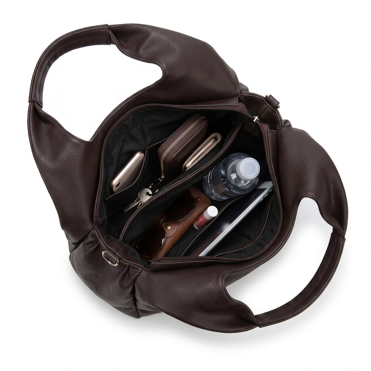 Top-down view looking inside the dark brown faux leather hobo bag, showing its organized interior with various items.