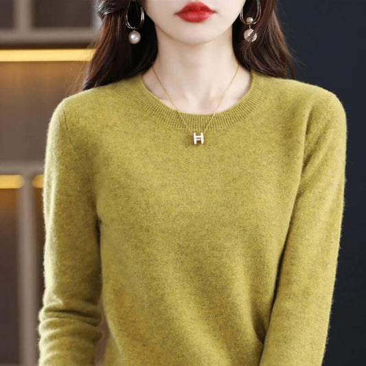 Front view of a woman wearing a lime green fine-knit crew neck sweater.