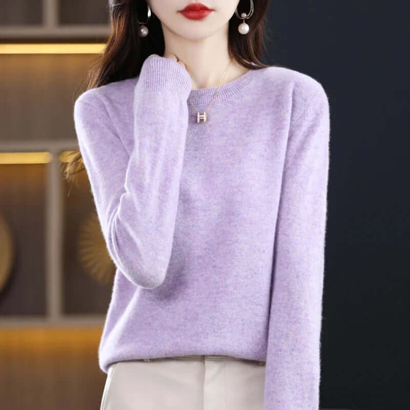 A model wearing a light purple long-sleeved crew neck sweater.