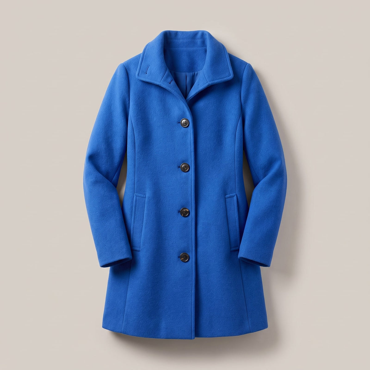 Top-down view of a bright blue women's wool coat with a wide collar and three dark buttons.
