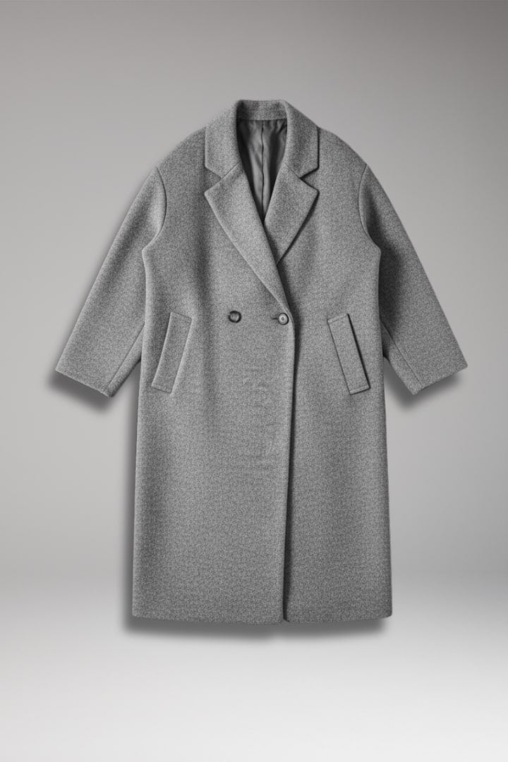 Front view of a grey double-breasted longline coat on a ghost mannequin.
