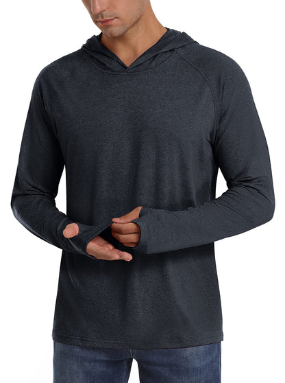Front view of a male model wearing a dark grey heathered long-sleeve hooded shirt, demonstrating the thumbholes.