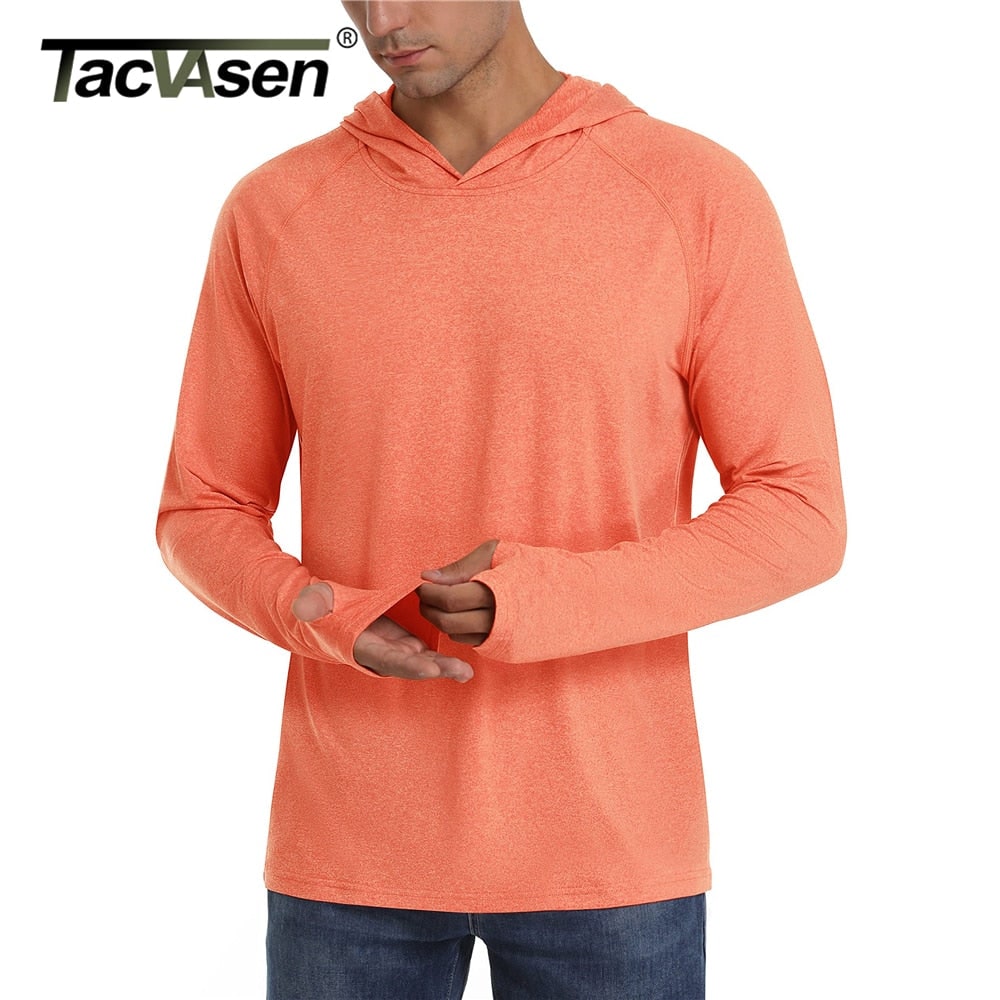 A male model wears an orange long-sleeve hooded shirt with thumbholes, with a brand logo in the top left.