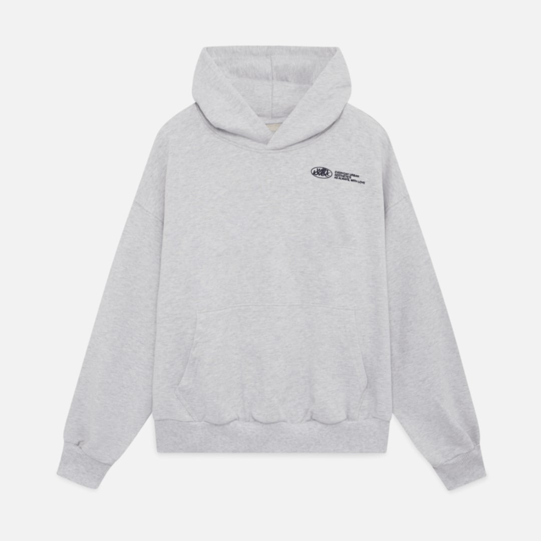 Flat lay front view of a light grey oversized hoodie with a small black chest graphic.