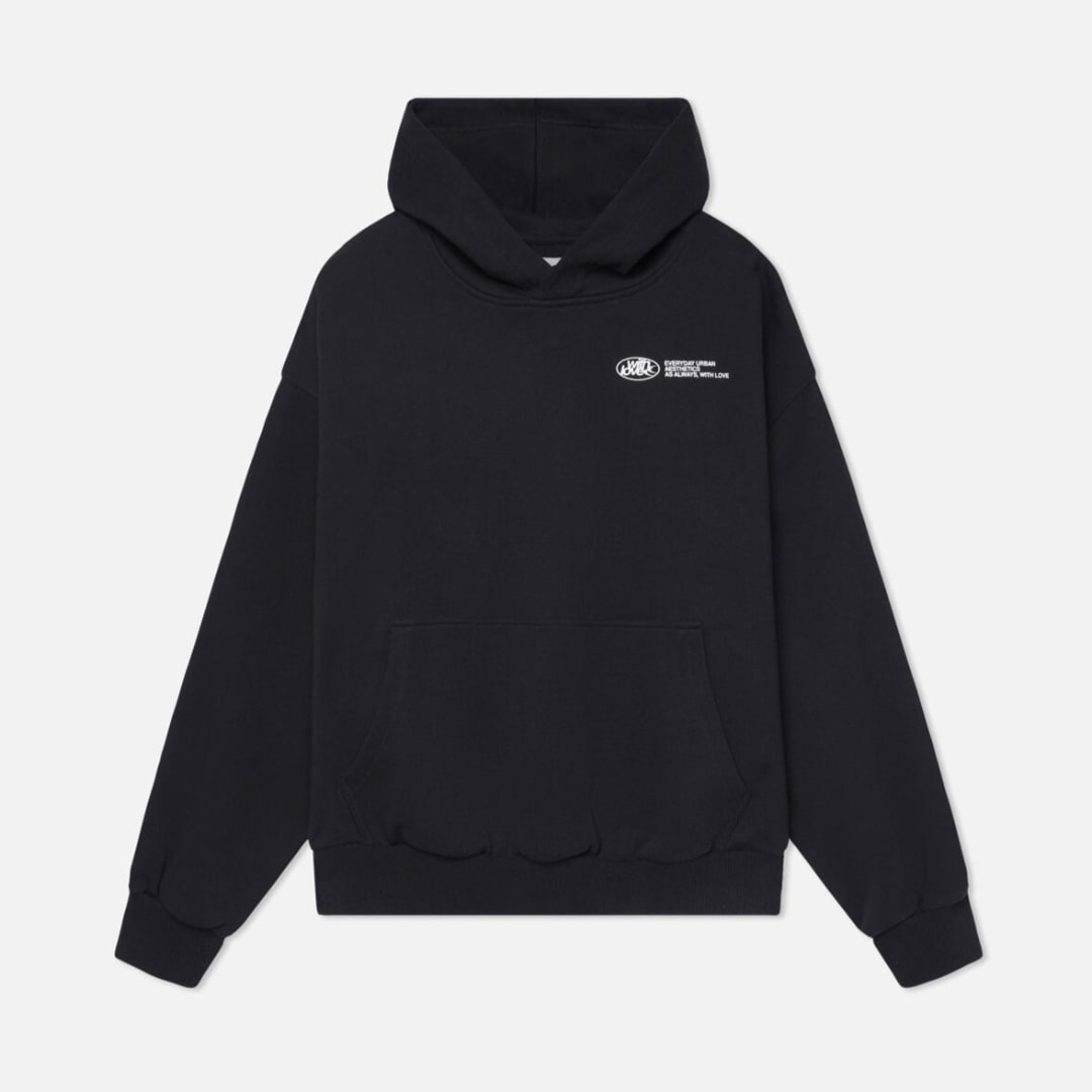 Flat lay front view of a black oversized hoodie with a small white chest graphic.