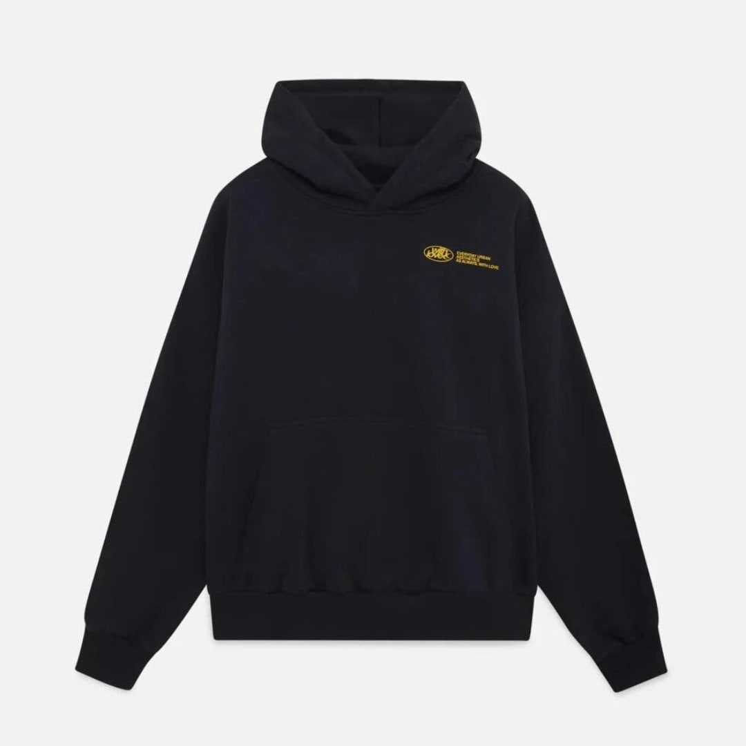 Flat lay front view of a black oversized hoodie with a small yellow chest graphic.
